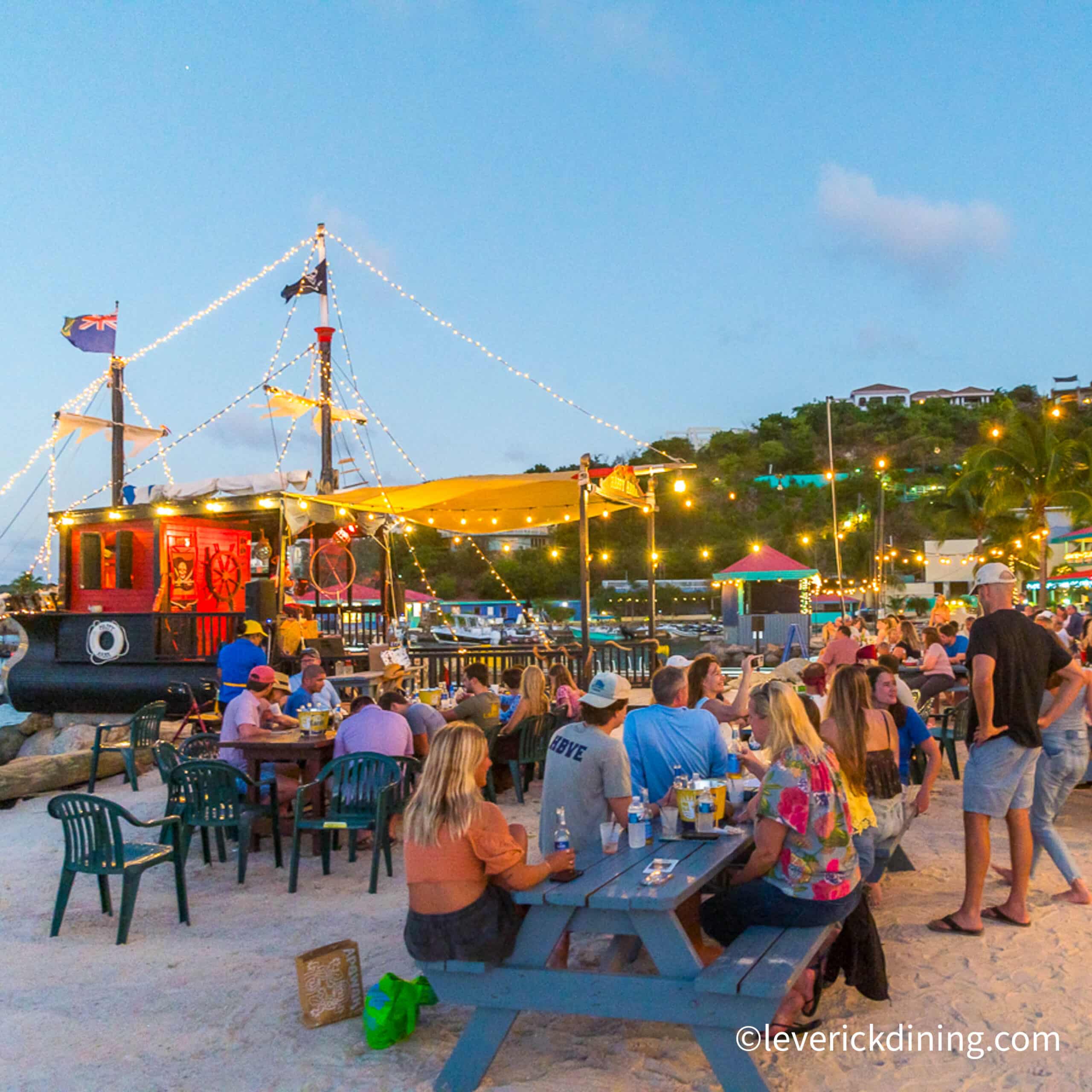 Sunset drinks at Jumbies Beach Bar in Leverick Bay, VG with guest about our North Sound Powerboat Tour.