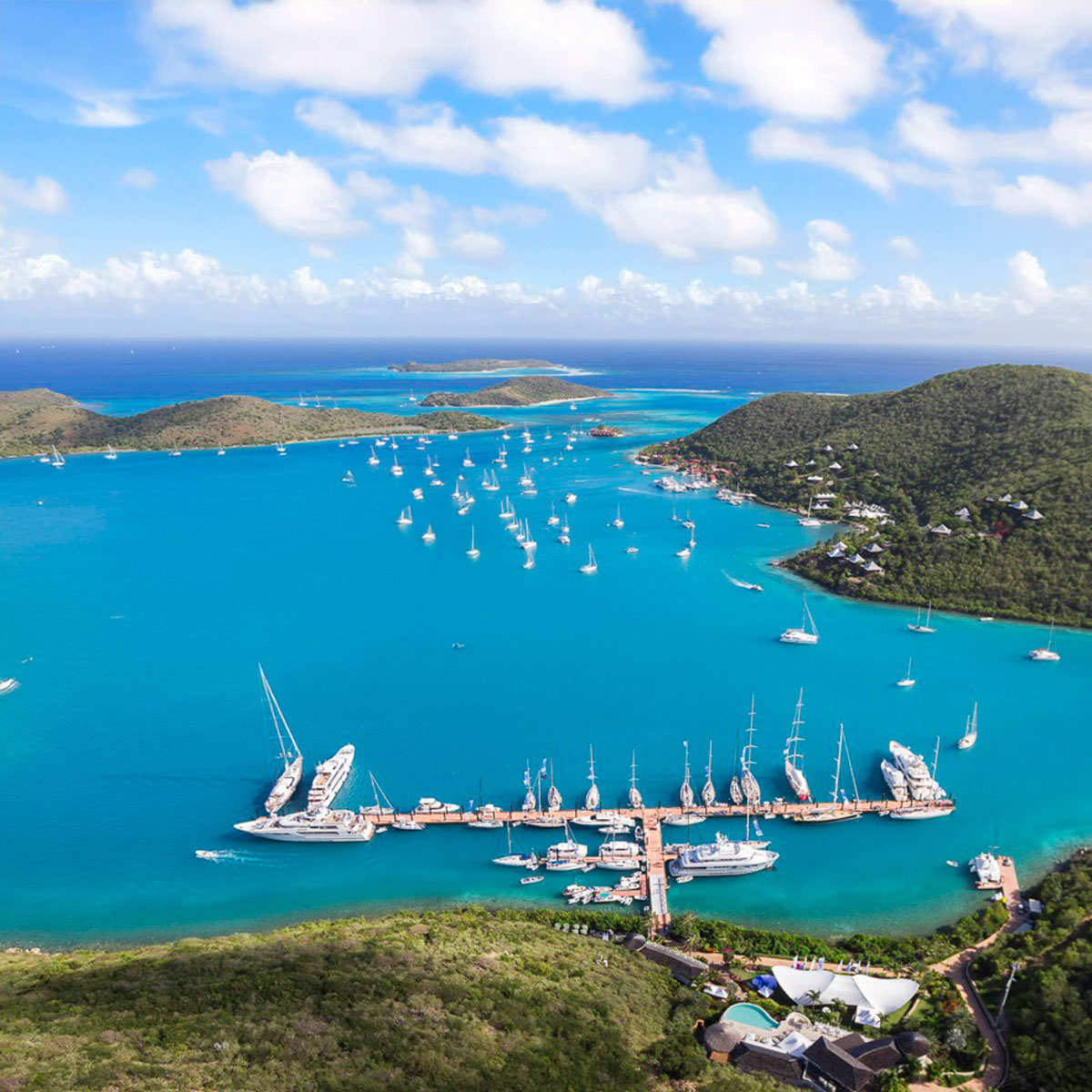 North Sounds VG during busy season, with mega yachts at YCCS, and crusing yachts anchored at Bitter End Yacht Club. Necker Island and Eustatia in the distance.